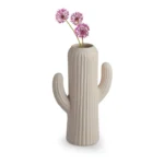 ceramic-cactus-vase-with-purple-flowers-white-background