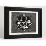Angled view of Sacred Ganesha woodcut wall art with black frame