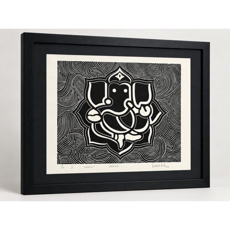 Angled view of Sacred Ganesha woodcut wall art with black frame