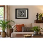 Framed Ganesha woodcut wall art styled above sofa in living room
