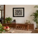 Framed Ganesha woodcut wall art on neutral dining room wall