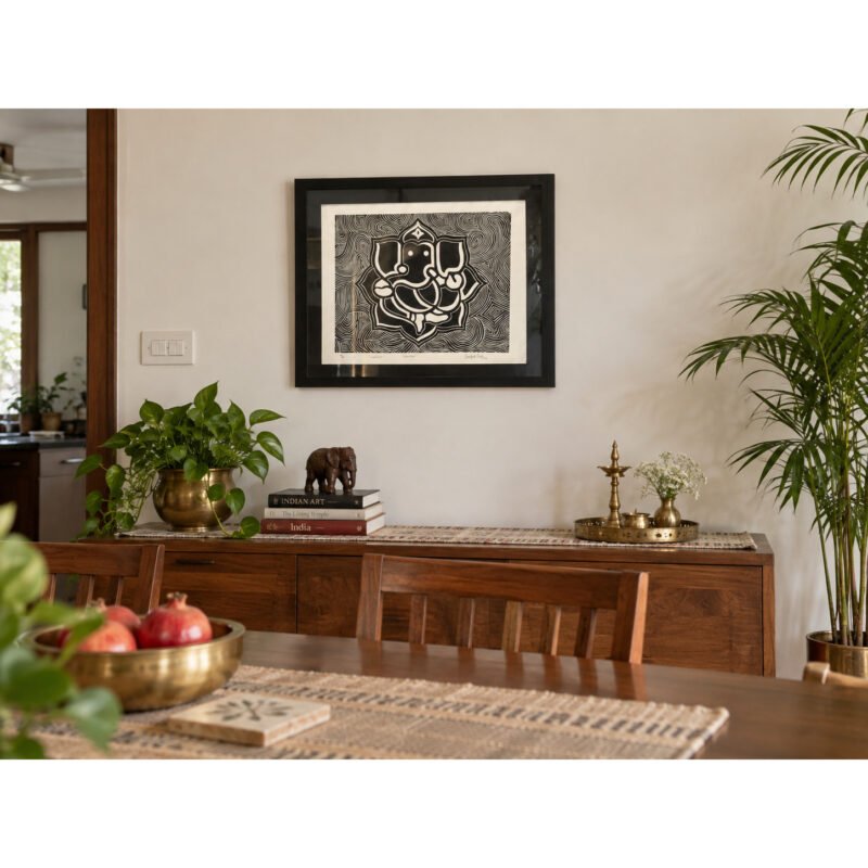Framed Ganesha woodcut wall art on neutral dining room wall