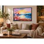 Framed floral sunset oil painting displayed above living room furniture
