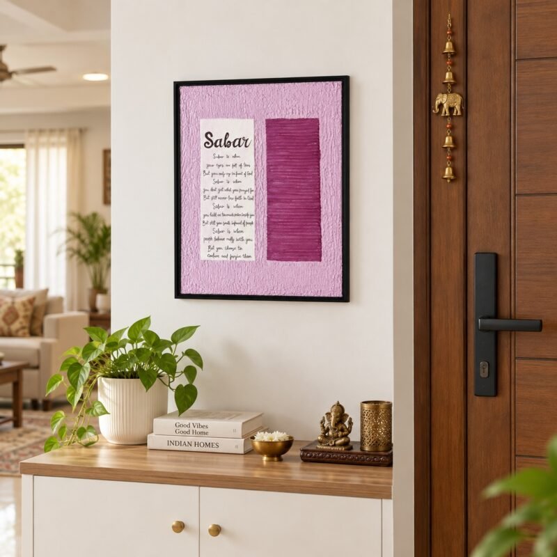 Sabar textured canvas wall art in black floating frame displayed near a modern Indian home entrance